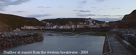 A view looking back towards the town from the western breakwater at dusk